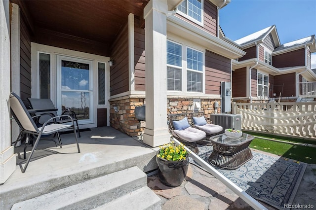 119 Jackson Dr, Erie, CO 80516 - view of patio / terrace with central air condition unit, a porch, and fence