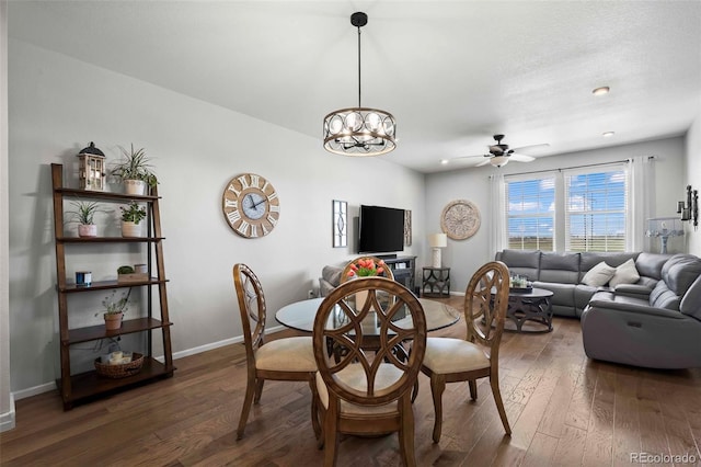 119 Jackson Dr, Erie, CO 80516 - dining room with baseboards, hardwood / wood-style floors, and ceiling fan with notable chandelier