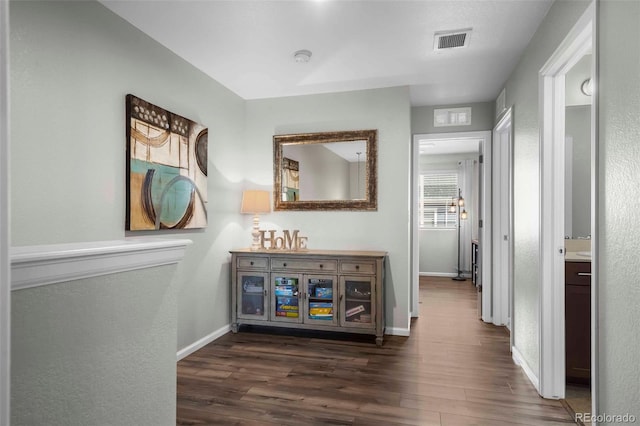 119 Jackson Dr, Erie, CO 80516 - corridor with baseboards, visible vents, a textured wall, and dark wood-style floors