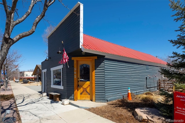 119 Jackson Dr, Erie, CO 80516 - exterior space featuring log veneer siding and metal roof