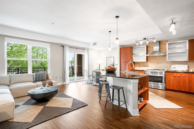 2240 N Clay St Unit 309, Denver, CO 80211 - kitchen with high end range, wall chimney range hood, open shelves, open floor plan, and dark countertops