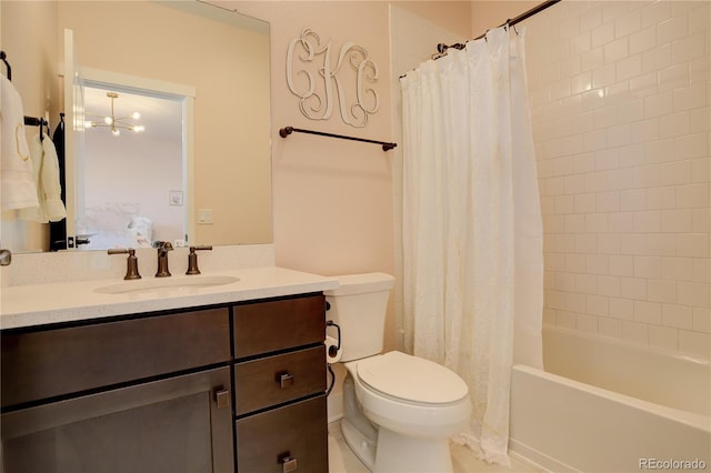 bathroom featuring shower / bath combo, connected bathroom, vanity, and toilet