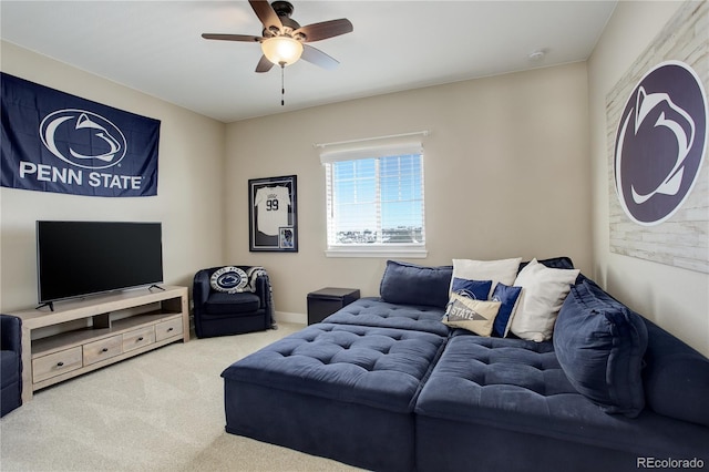 carpeted living room featuring ceiling fan