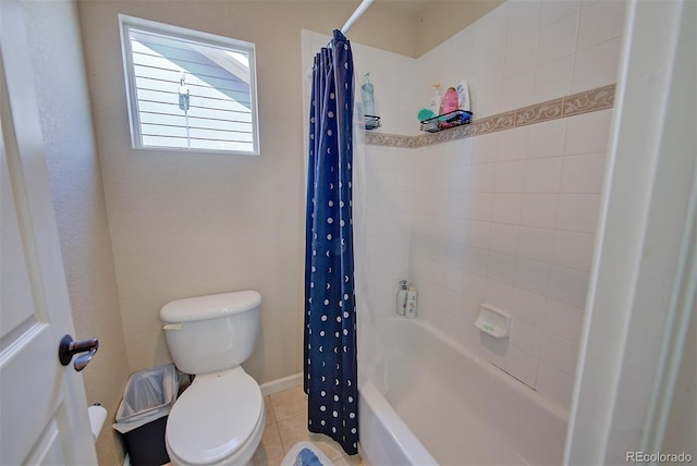 bathroom with shower / bath combo with shower curtain, tile patterned flooring, and toilet