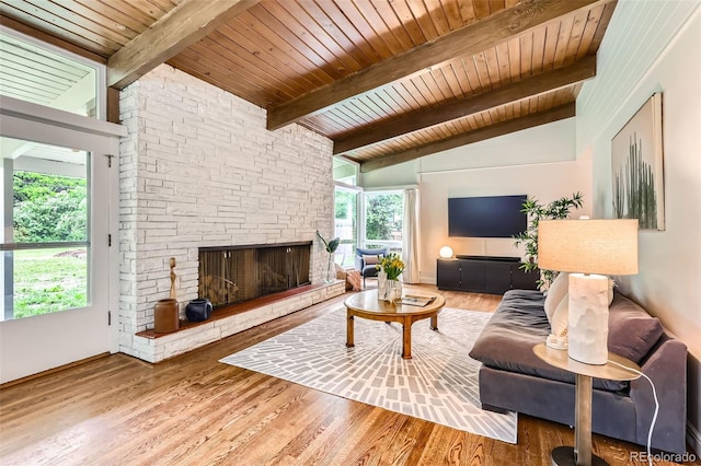 845 Everett St, Lakewood, CO 80215 - living room featuring wood ceiling, a fireplace, and wood finished floors