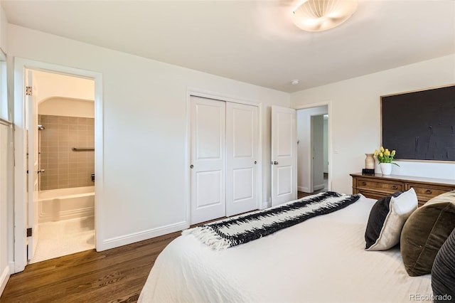 845 Everett St, Lakewood, CO 80215 - bedroom with dark wood-style flooring, a closet, ensuite bathroom, and baseboards