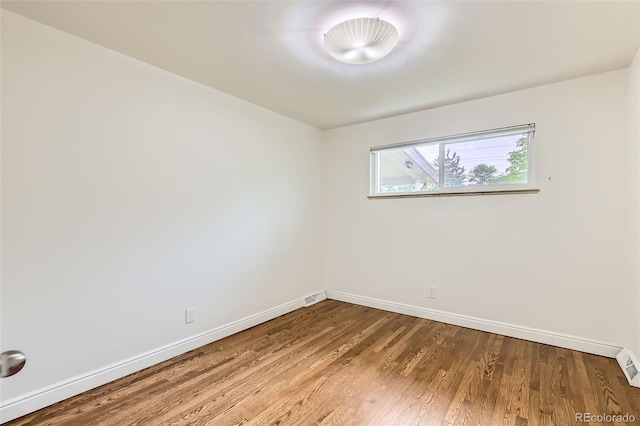 845 Everett St, Lakewood, CO 80215 - unfurnished room with baseboards and wood finished floors