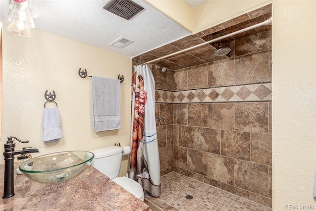 46303 E 106th Ave, Bennett, CO 80102 - full bath with a tile shower, toilet, and vanity