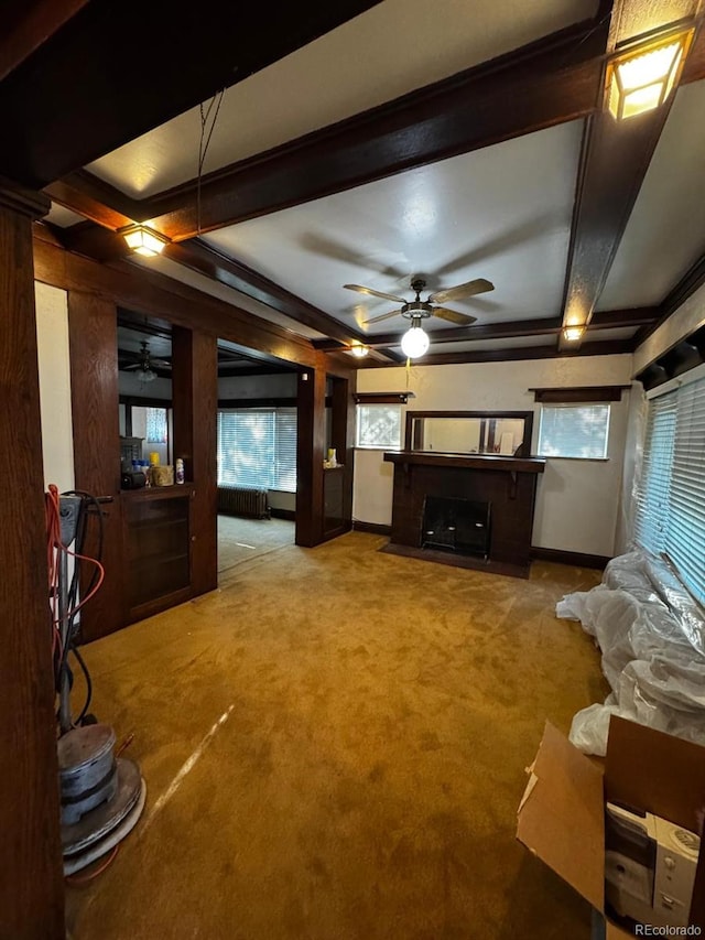 1731 E 25th Ave, Denver, CO 80205 - carpeted living room featuring a ceiling fan, a fireplace with flush hearth, beam ceiling, and coffered ceiling