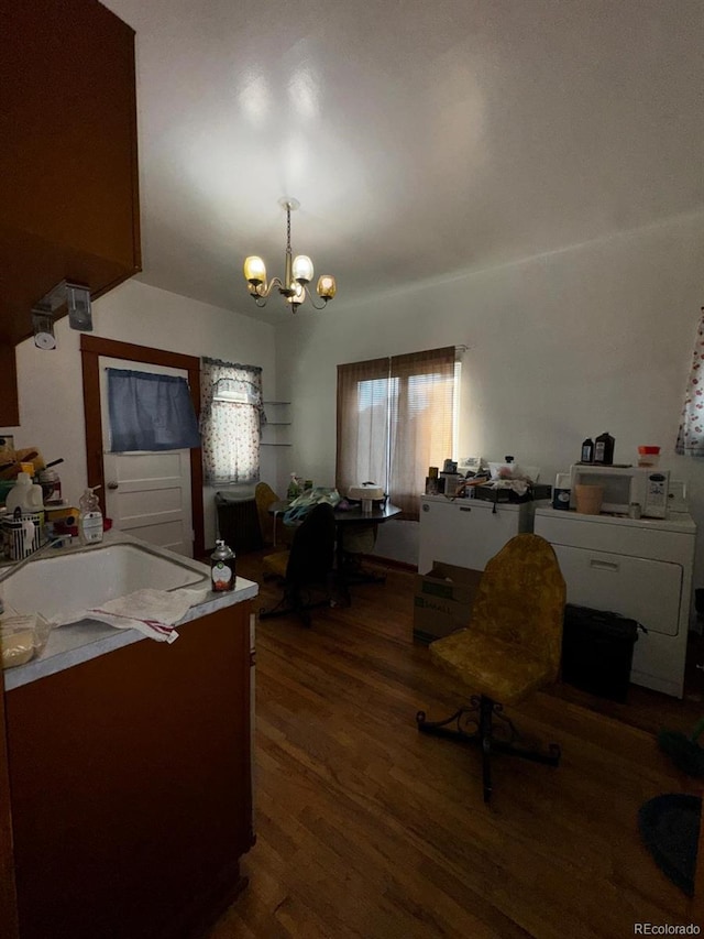 1731 E 25th Ave, Denver, CO 80205 - dining area featuring wood finished floors and a chandelier