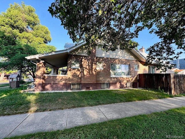 1731 E 25th Ave, Denver, CO 80205 - view of front of property featuring brick siding and a chimney