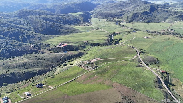 26000 Wheeler Creek Ln, Steamboat Springs, CO 80487 - aerial view of property and surrounding area with rural landscape and a mountainous background