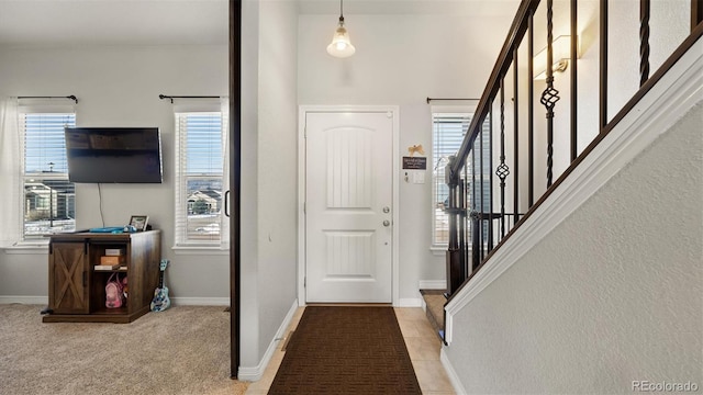 view of carpeted foyer