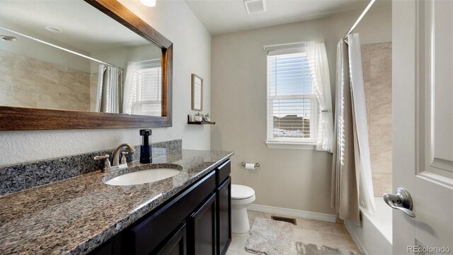 full bathroom with tile patterned floors, vanity, shower / bath combo, and toilet