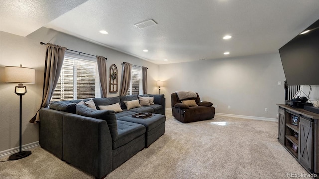 living room with light colored carpet and a textured ceiling