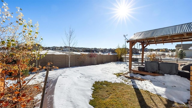 view of yard layered in snow