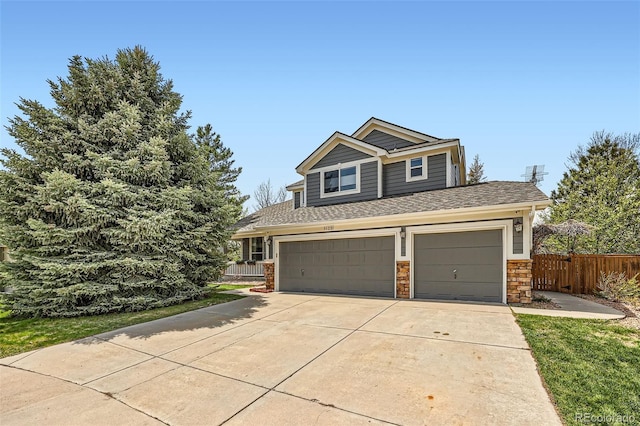 11321 Mesa Verde Pl, Parker, CO 80138 - view of front of property with driveway, stone siding, roof with shingles, and a garage