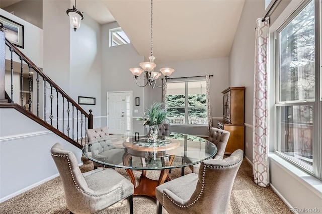 11321 Mesa Verde Pl, Parker, CO 80138 - carpeted dining space featuring a chandelier, stairway, high vaulted ceiling, and baseboards