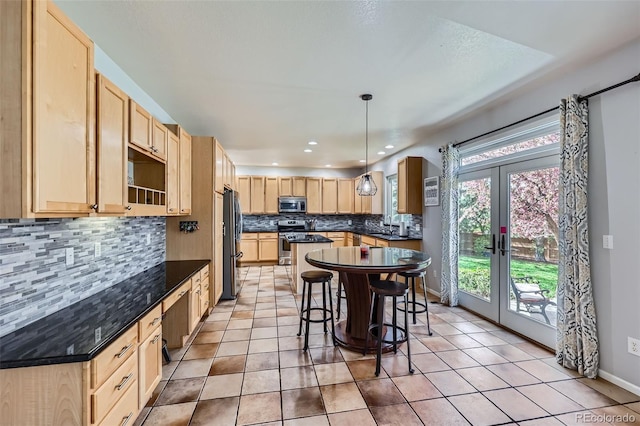 11321 Mesa Verde Pl, Parker, CO 80138 - kitchen with appliances with stainless steel finishes, light brown cabinets, dark countertops, tasteful backsplash, and light tile patterned floors