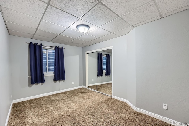11321 Mesa Verde Pl, Parker, CO 80138 - unfurnished bedroom with carpet flooring, a paneled ceiling, baseboards, and a closet