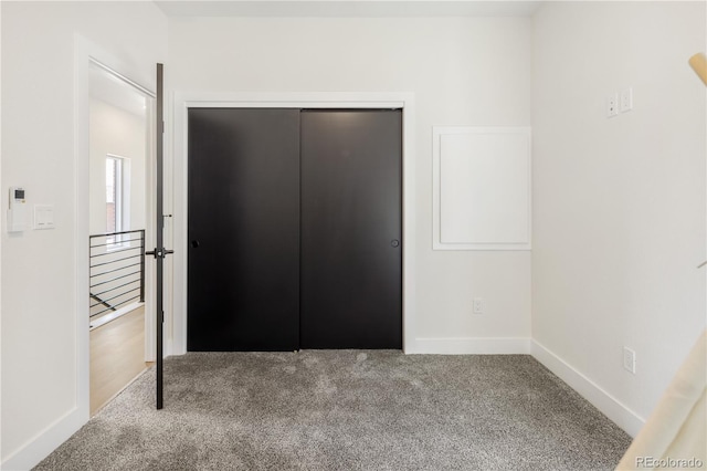 3295 Lawrence St, Denver, CO 80205 - unfurnished bedroom featuring carpet and a closet