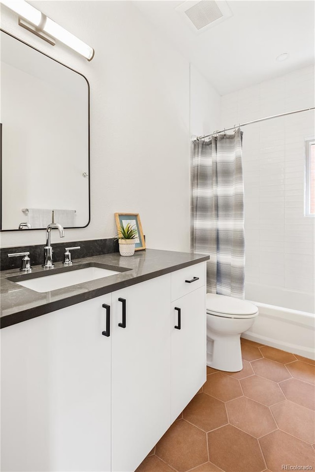 3295 Lawrence St, Denver, CO 80205 - bathroom featuring vanity, tile patterned floors, and washtub / shower combination