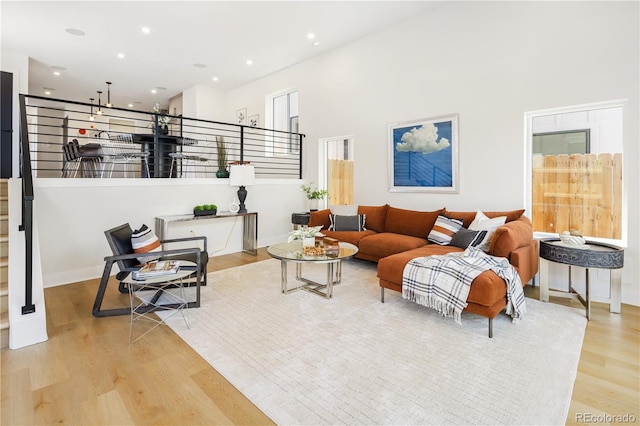 3295 Lawrence St, Denver, CO 80205 - living area featuring wood finished floors and recessed lighting