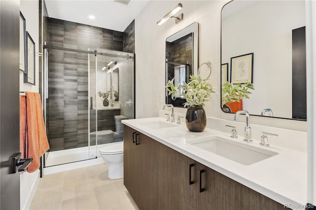 3295 Lawrence St, Denver, CO 80205 - full bathroom featuring double vanity, a stall shower, and recessed lighting