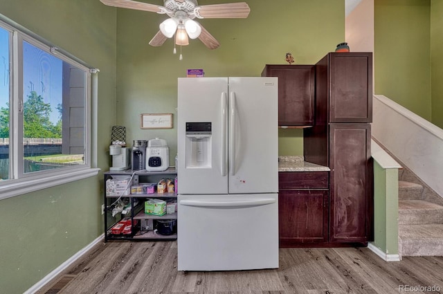3730 Hazelwood Ct, Colorado Springs, CO 80918 - kitchen with white refrigerator with ice dispenser, light wood-style floors, a ceiling fan, and dark brown cabinets