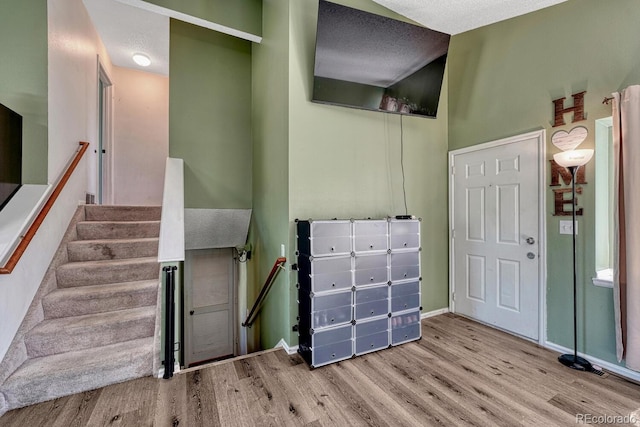 3730 Hazelwood Ct, Colorado Springs, CO 80918 - foyer entrance featuring wood finished floors and a textured ceiling