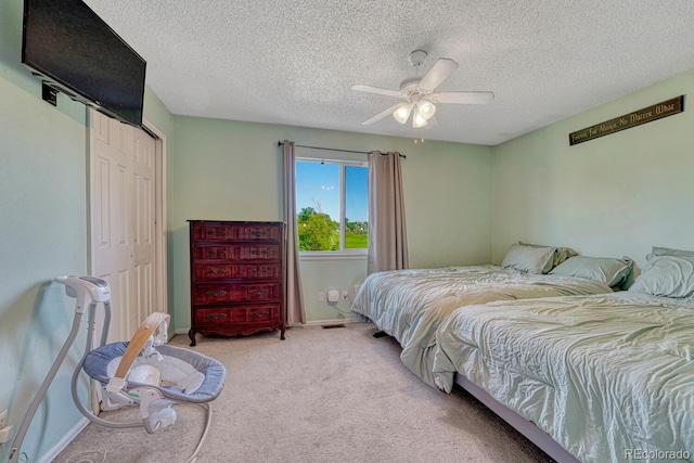 3730 Hazelwood Ct, Colorado Springs, CO 80918 - carpeted bedroom featuring a closet, a textured ceiling, and a ceiling fan
