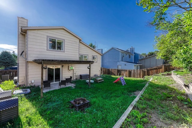3730 Hazelwood Ct, Colorado Springs, CO 80918 - rear view of property featuring a fenced backyard, a patio, and a chimney