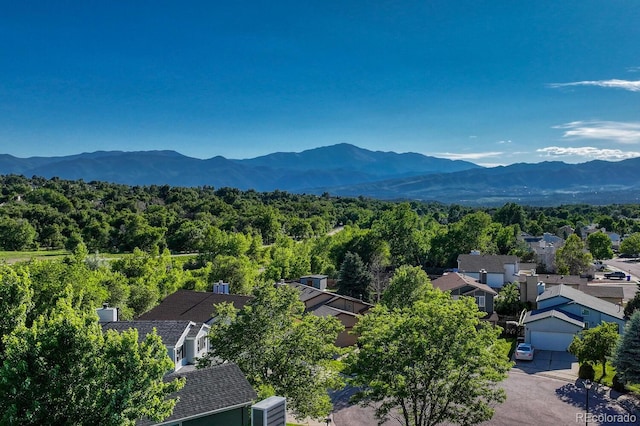 3730 Hazelwood Ct, Colorado Springs, CO 80918 - mountain view with nearby suburban area and a heavily wooded area