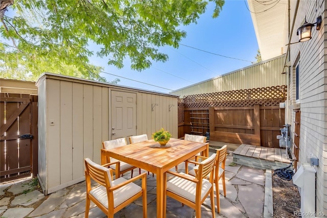 view of patio with a storage unit