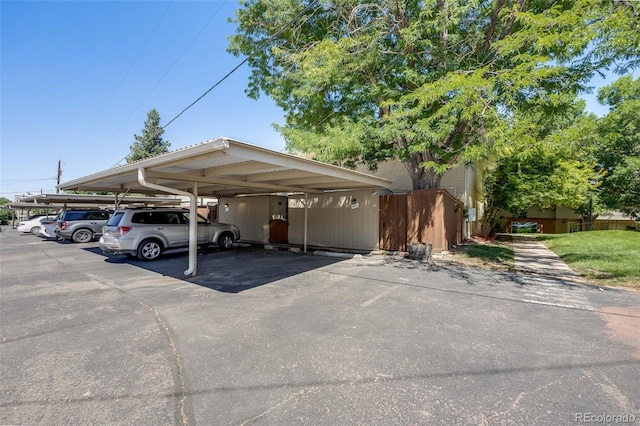 view of parking with a carport