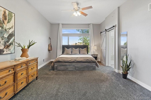 828 Rabbit Run Dr, Golden, CO 80401 - carpeted bedroom featuring a barn door and ceiling fan