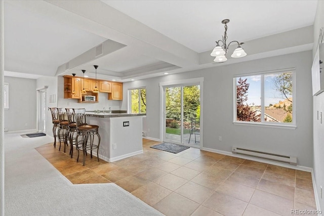 828 Rabbit Run Dr, Golden, CO 80401 - kitchen featuring a baseboard heating unit, a chandelier, open shelves, a kitchen bar, and a tray ceiling