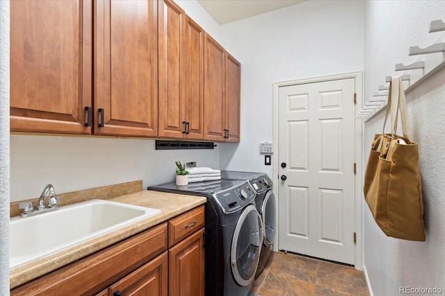 828 Rabbit Run Dr, Golden, CO 80401 - laundry area featuring cabinet space, washing machine and clothes dryer, and stone finish flooring