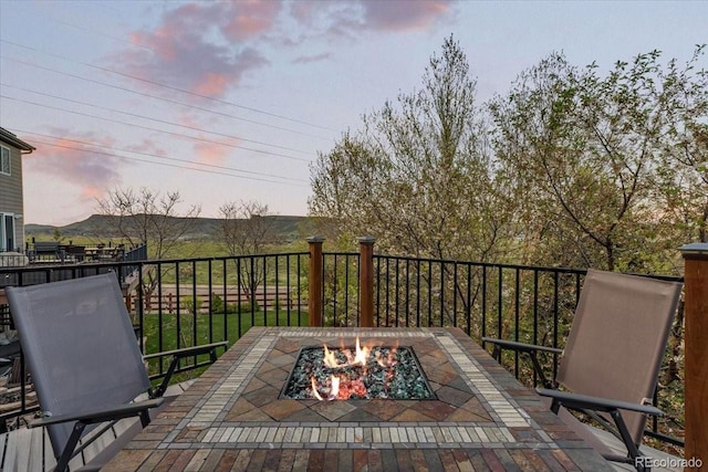 828 Rabbit Run Dr, Golden, CO 80401 - patio terrace at dusk with a fire pit