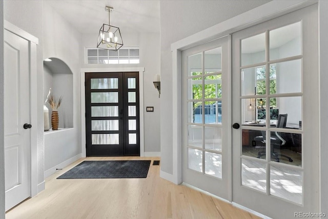 828 Rabbit Run Dr, Golden, CO 80401 - foyer entrance with french doors, wood finished floors, and a chandelier