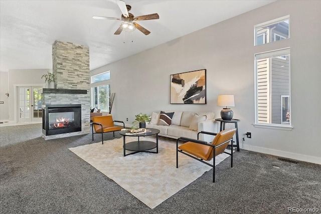 828 Rabbit Run Dr, Golden, CO 80401 - carpeted living room with a ceiling fan and a tile fireplace