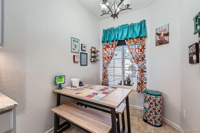 dining area featuring a chandelier