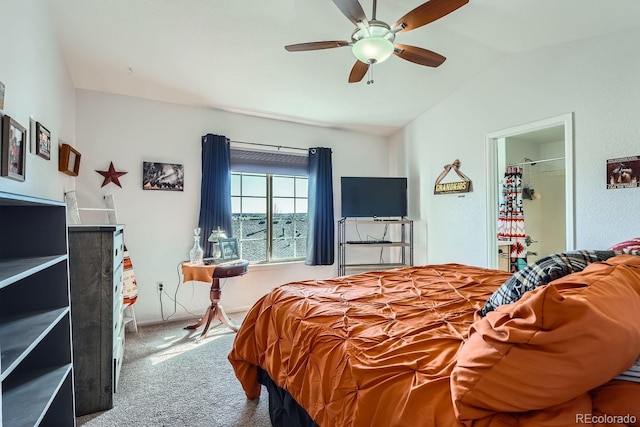 bedroom featuring vaulted ceiling, carpet flooring, and ceiling fan