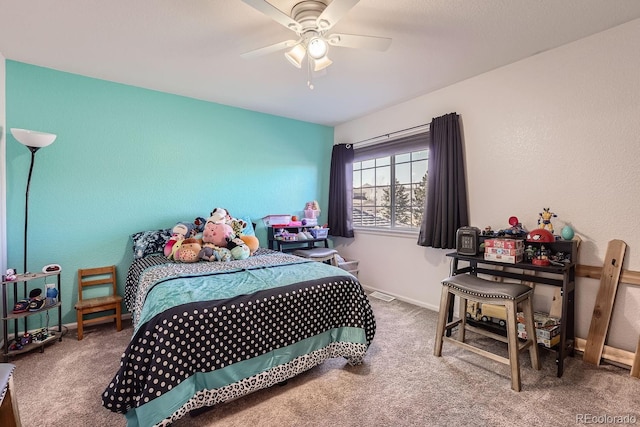 bedroom with ceiling fan and carpet flooring