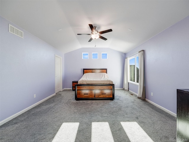 carpeted bedroom featuring lofted ceiling, a ceiling fan, and baseboards