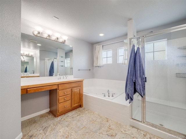 full bath with a bath, a shower stall, vanity, recessed lighting, and baseboards