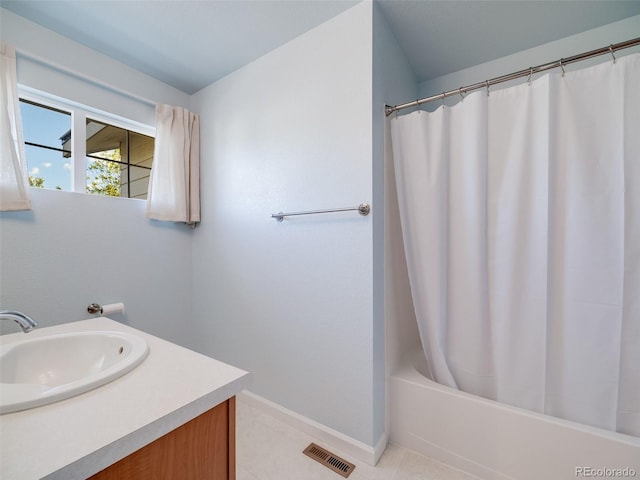 full bathroom with baseboards, vanity, shower / bath combination with curtain, and tile patterned floors
