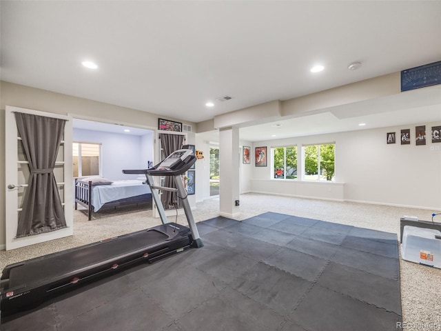 workout room with recessed lighting and baseboards