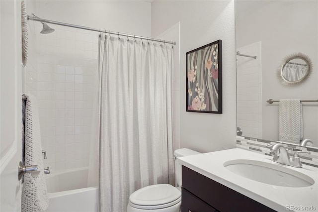 bathroom with vanity, shower / bath combo, and toilet