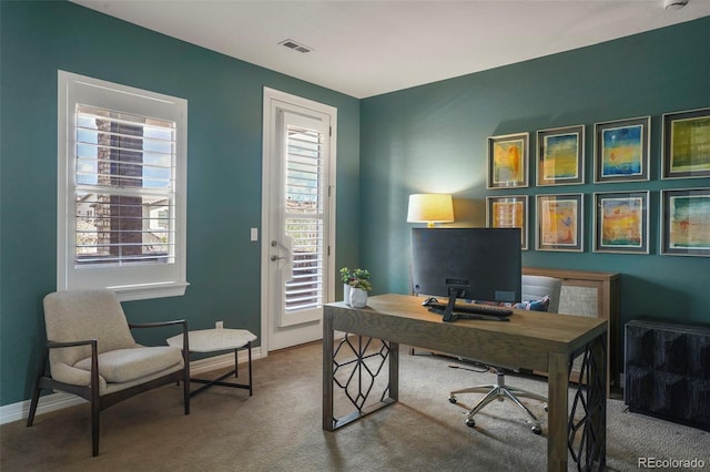 office space featuring visible vents, carpet, and baseboards